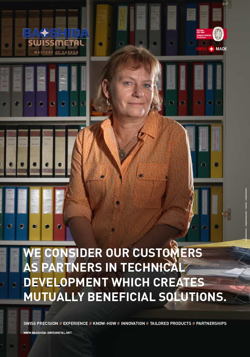 Affiche Swissmetal ou l'on peut voir une employée ainsi qu'un slogan publicitaire.